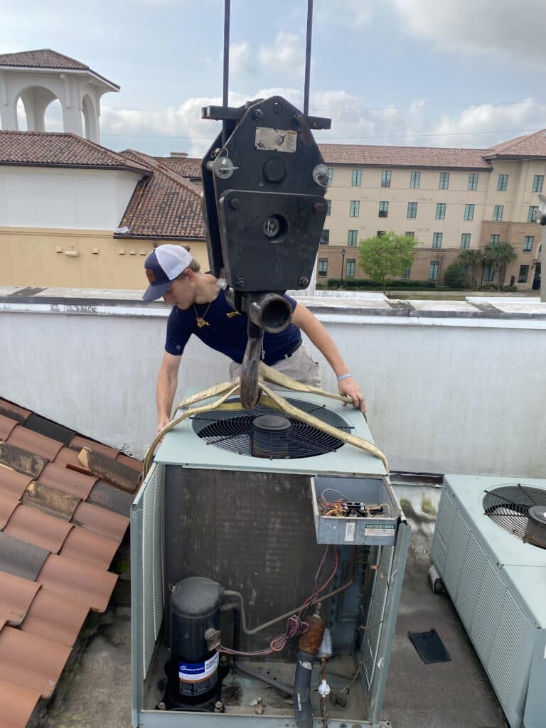 hvac technician installing a new air conditioning unit