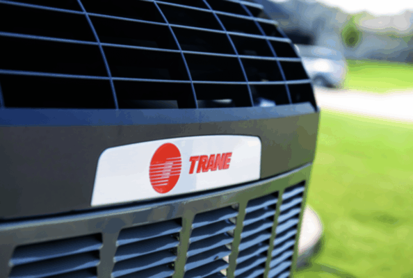a trane brand baton rouge air conditioning system outside in a yard