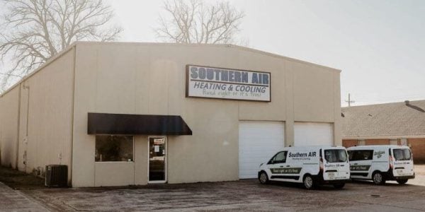 Southern Air Heating & Cooling commercial building with service vans parked outside in Louisiana.